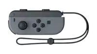 a gray nintendo switch controller with a black strap