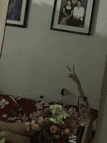 a person taking a picture of themselves in a mirror with a peace sign