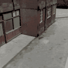 a brick building with a shadow of a person on the ground