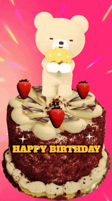 a birthday cake with strawberries and a teddy bear holding a bouquet of flowers