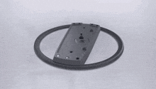 a ps5 is sitting on a stand with the power button on the side