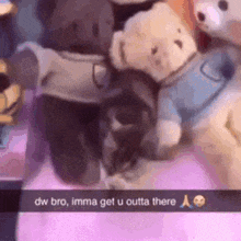 a group of teddy bears are sitting on top of a bed .