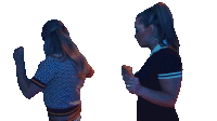 two women are standing next to each other with their fists up