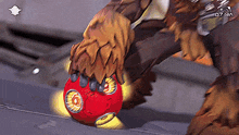 a cartoon character is kicking a red ball with the letters a7awa on the bottom