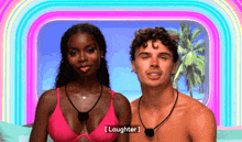a man and a woman are standing next to each other and the woman is wearing a pink bikini top
