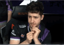 a man wearing a purple shirt that says twitch