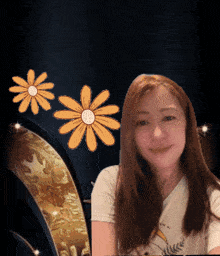 a woman wearing a shirt that says ' i love you ' on it smiles in front of three flowers