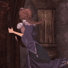 a woman in a purple dress is standing in a doorway