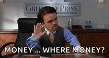 a man in a suit and tie is sitting at a desk asking where money