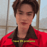 a young man in a red jacket is saying i have 99 problems