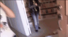 a blurry picture of a person standing in front of a door .