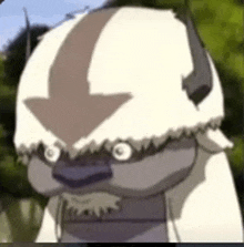 a close up of a cartoon character with horns and an arrow in his head .