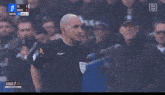 a soccer game is being played and the score is 1 to 2