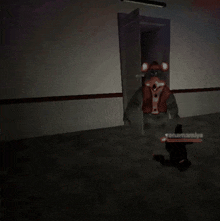 a teddy bear is standing in a dark room next to a person