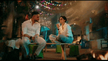 a man and a woman are sitting on a bench and talking