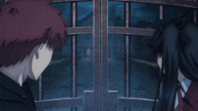 a boy and a girl are standing next to each other and looking at each other