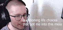 a man wearing headphones and glasses is talking about questioning life choices that got me into this mess