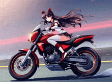 a girl is riding a red motorcycle with a yamaha logo on the back