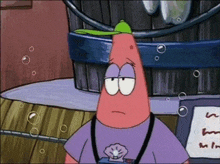 patrick star from spongebob is wearing a green hat and a purple shirt