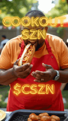 a man in a red apron is eating a hot dog with the words cookout szn $ cszn behind him