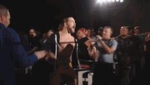 a man stands in front of a sign that says ' chris is awesome viro the virus '