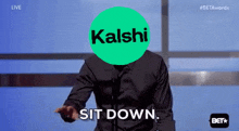 a man is giving a speech with a kaishi logo on his face