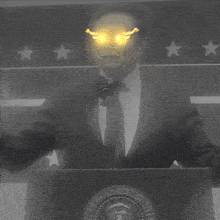 a man stands behind a podium with the presidential seal on it