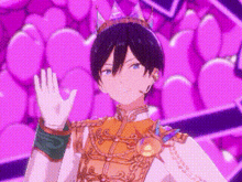 a boy in a crown is waving his hand in front of a pink background .