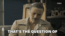 a man says that 's the question of while sitting at a table