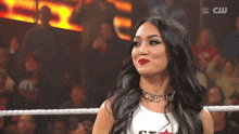 a woman in a wrestling ring is wearing a shirt that says star on it