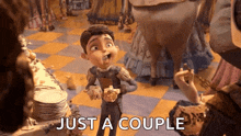 a cartoon character is standing next to a woman and says just a couple