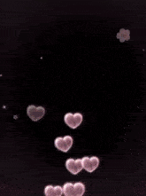 a girl with blue hair is surrounded by pink hearts and white flowers