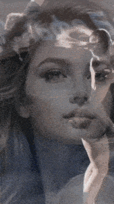 a double exposure of a woman 's face with a man 's face behind her