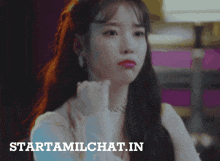 a picture of a woman with the words starttamilchat.in on the bottom right