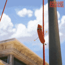 a sausage with arms and legs is hanging from a pole with the words sausage party foodtopia below it