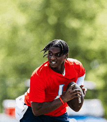 a football player in a red jersey with the number 1 on it