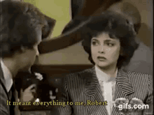 a man and a woman are talking to each other in a room .