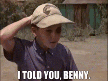 a young boy wearing a baseball cap says " i told you benny "
