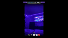 a screen shot of a bedroom with purple lights and a tv that says panic 48 on it