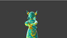 a statue of a woman in a blue and gold dress with horns