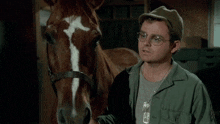 a man standing next to a horse with the words it 's a horse sir