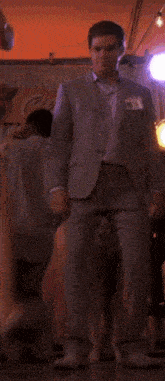 a man in a suit with a name tag that says ' chris '