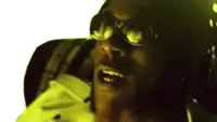 a close up of a man wearing glasses and a hurley hat