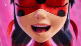 a close up of a ladybug cartoon character 's face with her eyes closed .