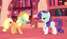 a couple of ponies standing next to each other in a room