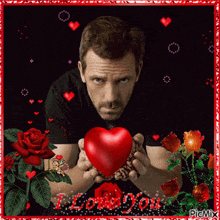 a picture of a man holding a red heart with the words i love you written on the bottom