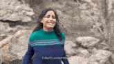 a woman in a blue and green striped sweater says i don 't understand