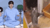 a boy in a blue hoodie is sitting on the floor next to a cat in a cat litter box .