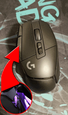 a black logitech mouse with a red arrow pointing to the right