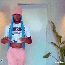 a person wearing a t-shirt that says ' issing ' on it